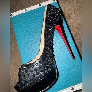 Gorgeous Christian Louboutin black spiked peep-toe platform heels.
